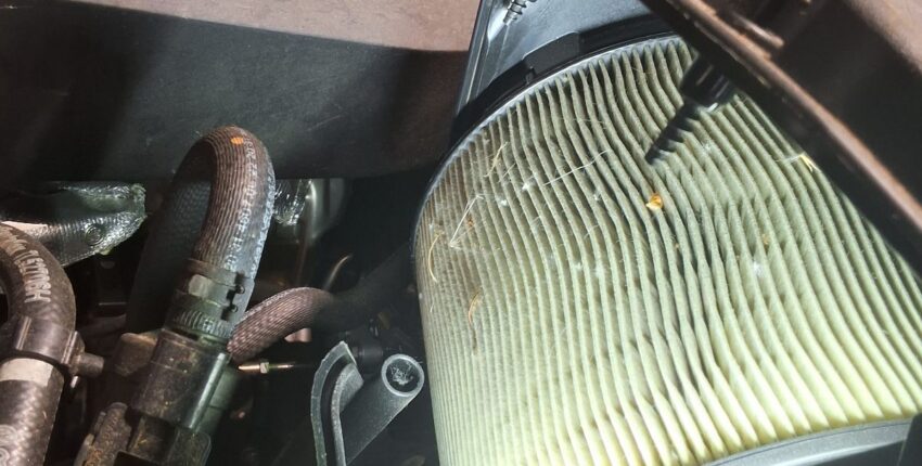 Engine air filter being inspected on an Audi Q5.