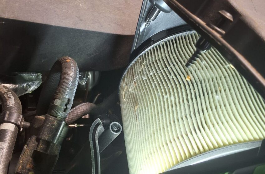 Engine air filter being inspected on an Audi Q5.
