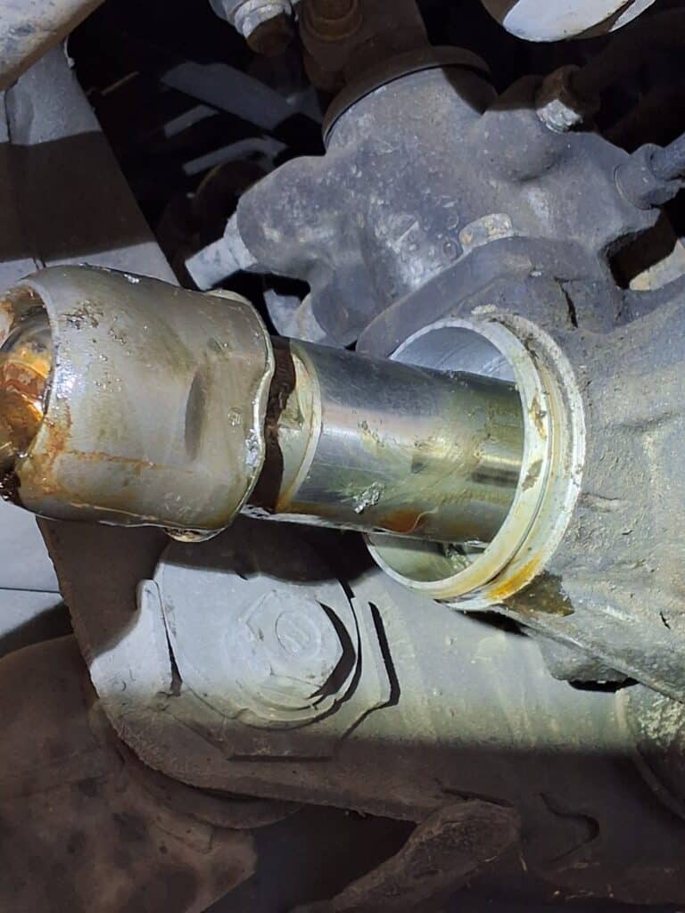 Inner tie rod inspected for excessive steering play on a Toyota 4Runner.
