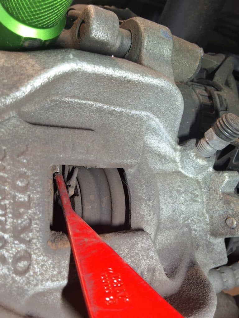 Rear brake components being inspected on a 2019 Volvo XC60.