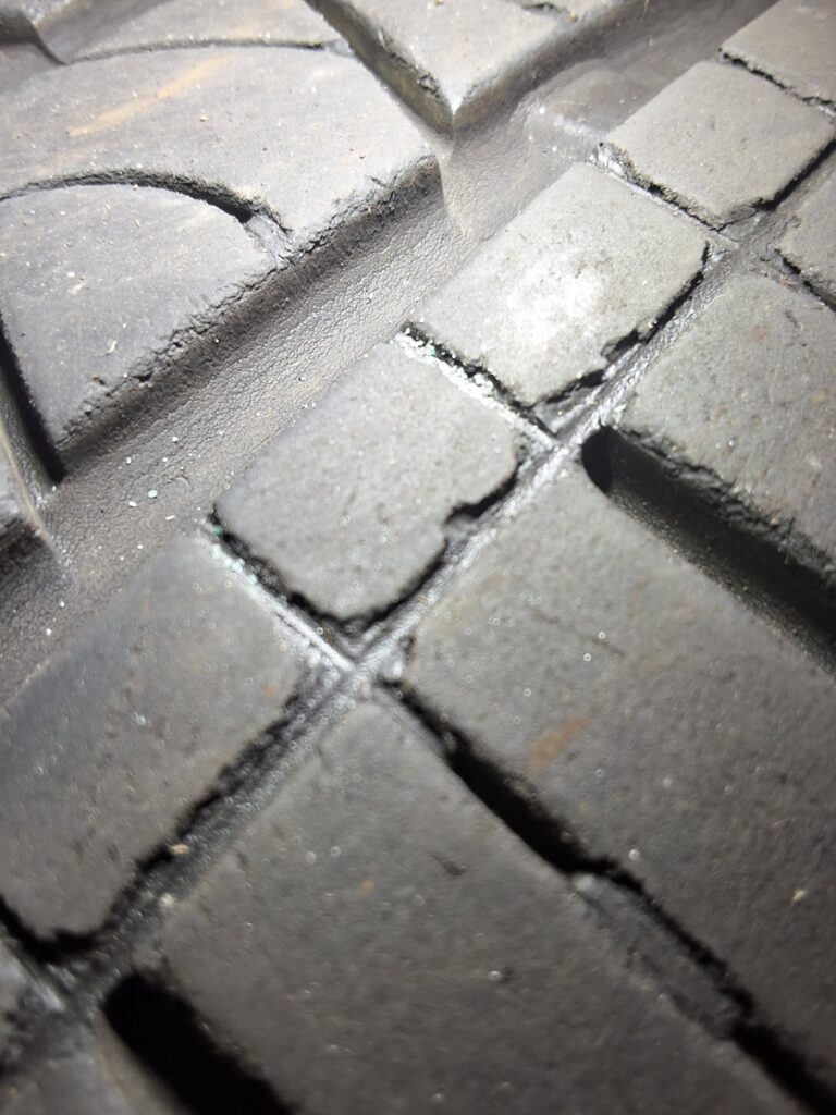 Weather cracking visible on a tire from a low-mileage 2019 Volvo XC60.