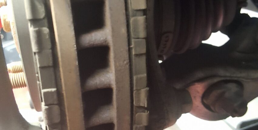 Front brake components on a Lexus IS250 during inspection at 34th Street Garage.