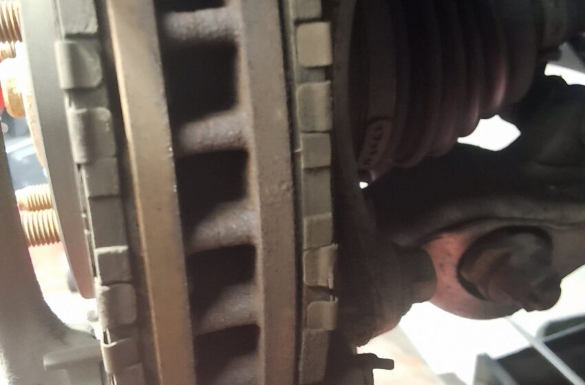 Front brake components on a Lexus IS250 during inspection at 34th Street Garage.